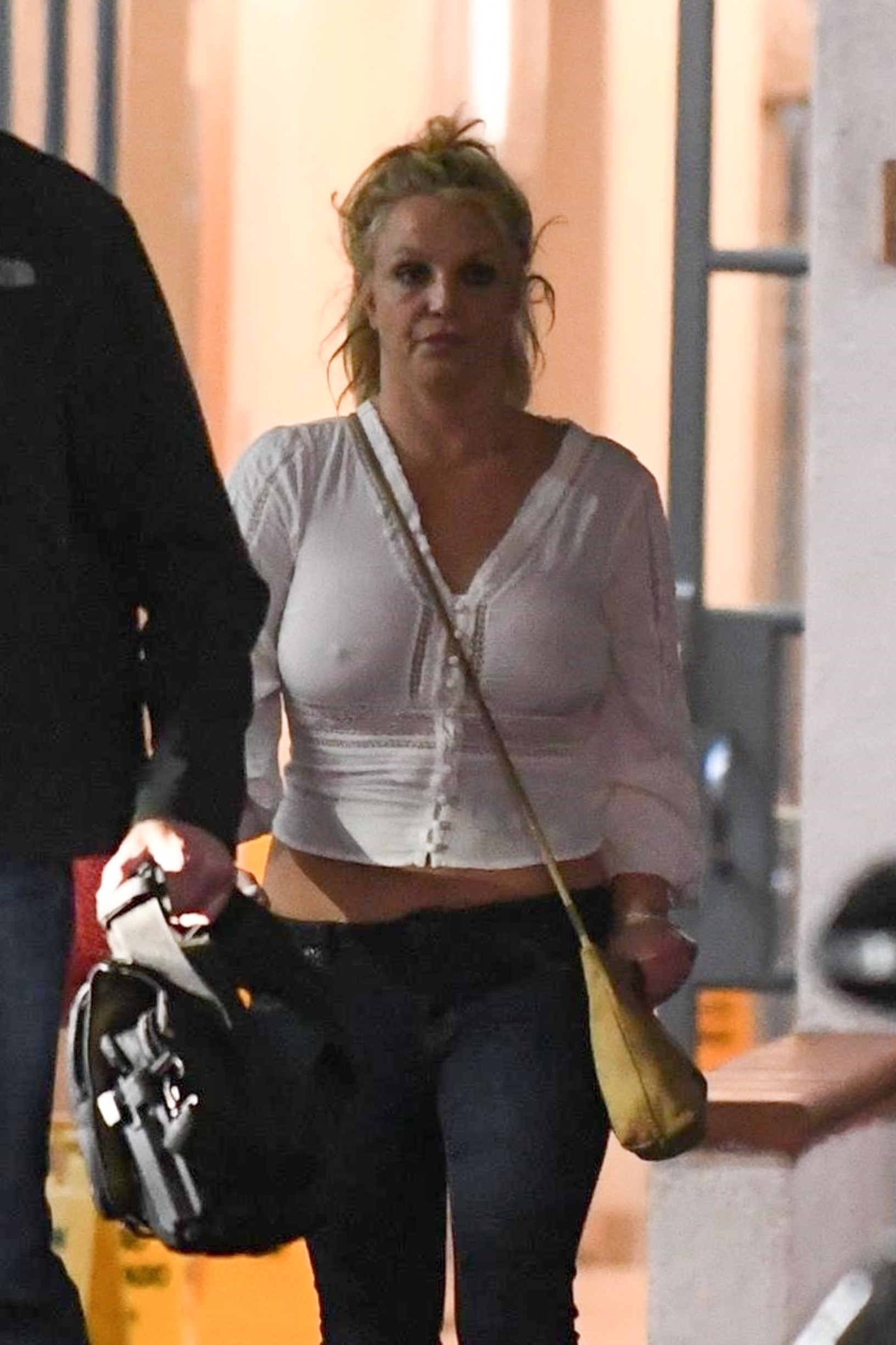 Los Angeles, CA  - *EXCLUSIVE*  -*Web Must Call For Pricing*  A disheveled Britney Spears leaves a medical building in Los Angeles with bodyguards in tow. The 38 year old pop star appeared tired  and a bit untidy in low cut jeans, a peasant blouse with no bra, white socks with slides and her hair pulled up in a messy ponytail. Spears was recently spotted in Miami celebrating her birthday with boyfriend Sam Asghari.

*UK Clients - Pictures Containing Children
Please Pixelate Face Prior To Publication*, Image: 486550413, License: Rights-managed, Restrictions: , Model Release: no, Credit line: BACKGRID / Backgrid USA / Profimedia